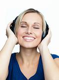 Close-up of woman listening to music with headphones on