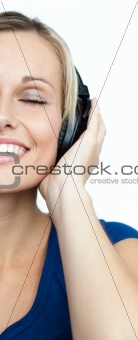 Close-up of woman listening to music and closed eyes