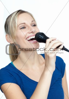 Woman singing on a microphone