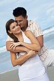 Man and Woman Couple In A Romantic Embrace On Beach