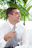 Businessman relaxing with a cup of coffee