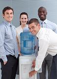 Busines people standing around water cooler