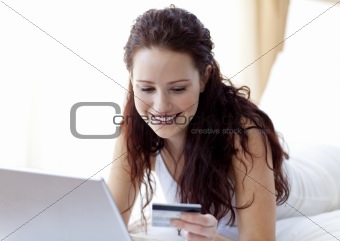 Smiling beautiful woman shopping online