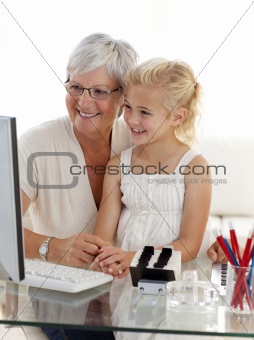 Granddaughter and grandmother using a computer