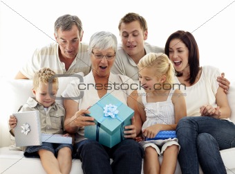 Family opening presents in grandmother's birthday