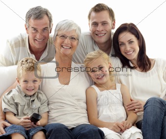 Family watching television at home