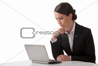  The young woman works on a computer