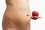 Overweight woman body holding apple