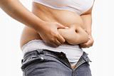 Fat woman pinching her fat tummy