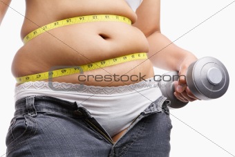 fat woman holding weight to exercise