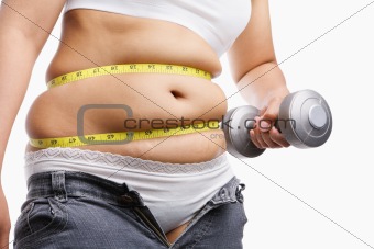 fat woman holding weight to exercise