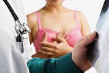 Doctor examine xray slide with woman on pink bra