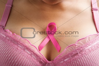 pink ribbon in woman chest