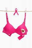 Broken pink bra with ribbon for breast cancer concept
