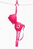 Broken pink bra with ribbon for breast cancer concept