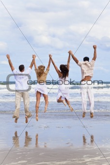 Four Young People, Two Couples, Jumping in Celebration On Beach