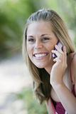 Smiling Woman Outdoors with Cell Phone 