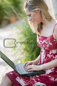 Young Woman Outside With Laptop