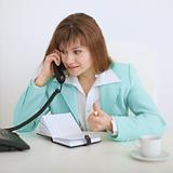 Girl - secretary emotionally speaks on the phone
