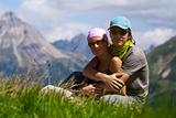 Couple in mountains looking at camera