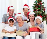 Happy family holding Christmas presents
