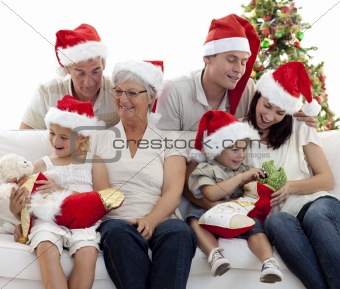 Happy family with Christmas gifts at home