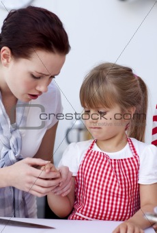Little girl injured by a knife in kitchen
