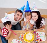 Little girl celebrating her birthday with her family