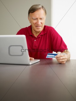 senior man doing online shopping