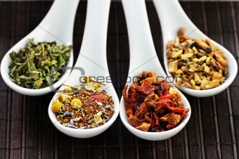 Assorted herbal wellness dry tea in spoons