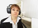 Comical girl in big stereos ear-phones