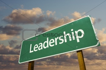 Leadership Green Road Sign with dramatic blue sky and clouds.