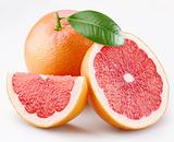 Grapefruits and segments with a leaf on a white background