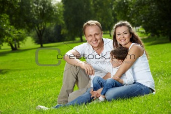 Joyful parents and small son