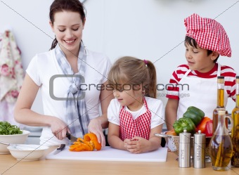 Happy family preparing lunch in the kitchen