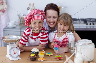 Mother and children baking in the kitchen