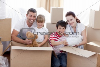 Family moving home with boxes around