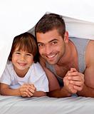 Father and son together under the bedsheets