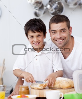 Smiling father and son preparing a toast