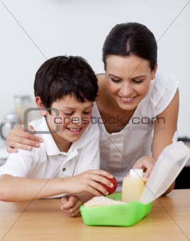 Mother and son making the school lunch