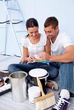 Couple with colour samples to paint new house