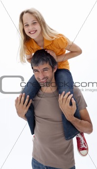 Father giving daughter piggyback ride against white