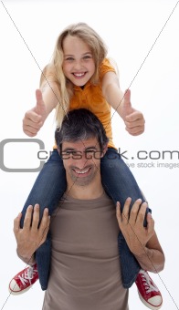 Father giving daughter piggyback ride with thumbs up