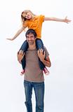 Father giving happy daughter piggyback ride