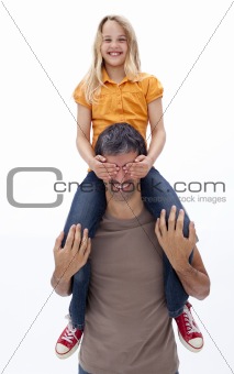 Father giving daughter piggyback ride with closed eyes