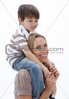 Close-up of mother giving son piggyback ride
