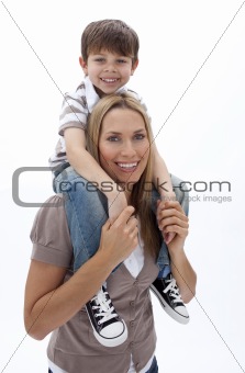 Mother giving son piggyback ride