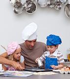 Father baking cookies with his children