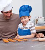 Father and son baking in the kitchen