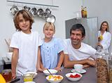 Smiling family preparing breakfast